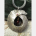 Fold form jasper gemstone and German silver cocoon pendant