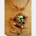 Mixed metal sterling and copper wire woven lampwork organic swirling pendant