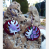Trashy Tinsel dangle earrings with leaves in purple and maroon