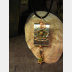 Zen prayer pendant of mixed metals with word wisdom inside