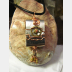 Zen prayer pendant of mixed metals with word wisdom inside