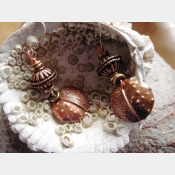 Copper fold form tribal dangle earring