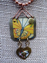 Trashy tin butterfly mixed metal love pendant
