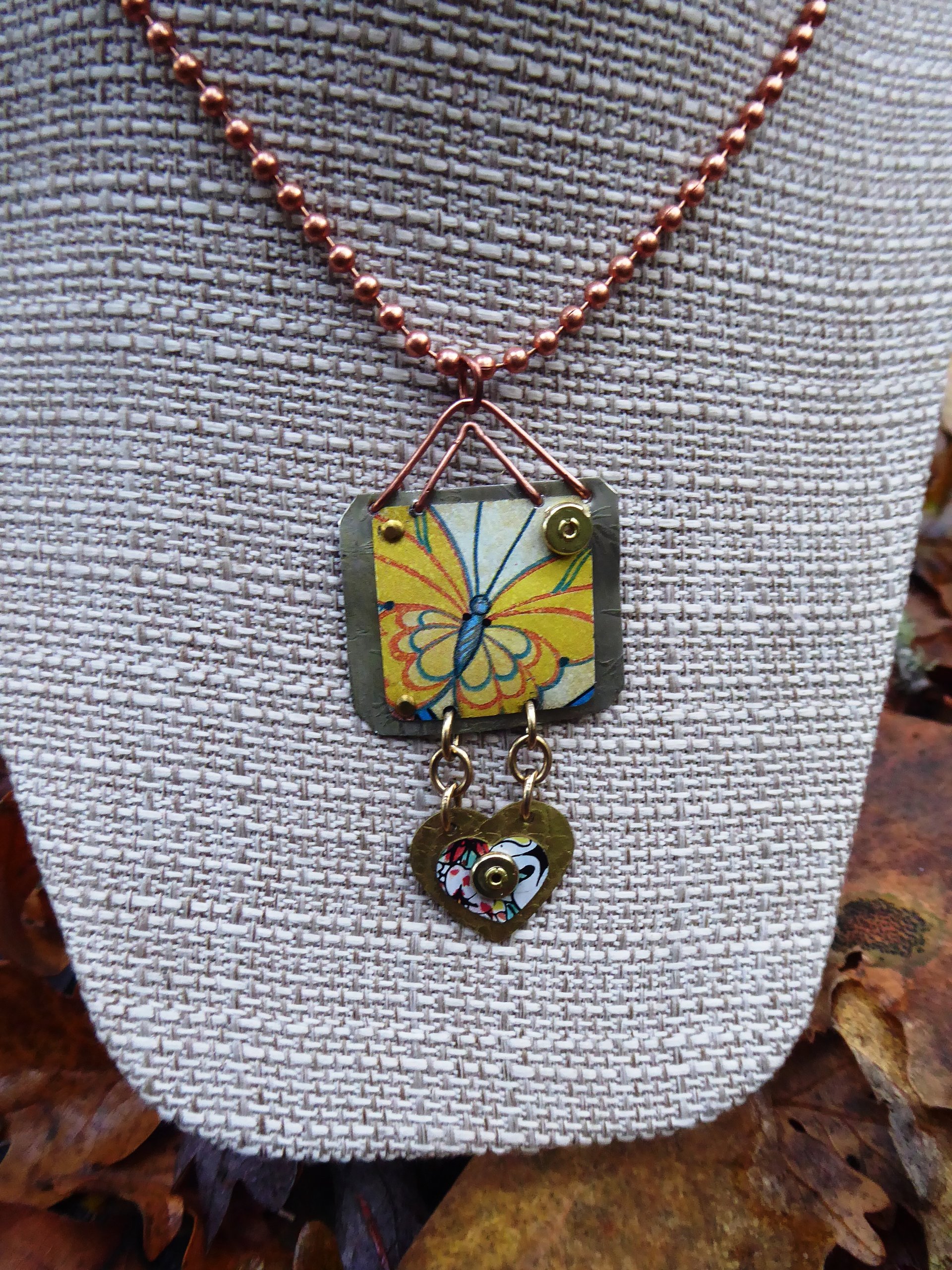 Trashy tin butterfly mixed metal love pendant