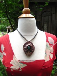 Copper mixed metal large fold form cocoon pendant with turquoise