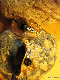 Tribal fold form bronze leaf earrings with sterling and black onyx