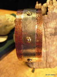 Mixed metal copper and German silver textured leaf design healing cuff