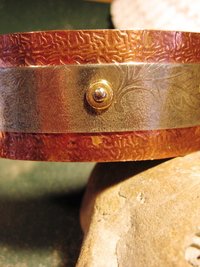 Mixed metal copper and German silver textured leaf design healing cuff