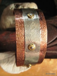 Mixed metal copper and German silver textured leaf design healing cuff