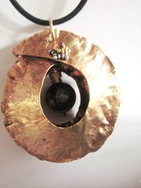 Tribal fold form bronze and iron pyrite healing cocoon pendant