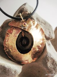 Tribal fold form bronze and iron pyrite healing cocoon pendant