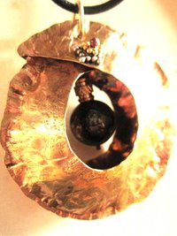 Tribal fold form bronze and iron pyrite healing cocoon pendant