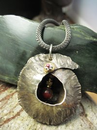 Fold form jasper gemstone and German silver cocoon pendant