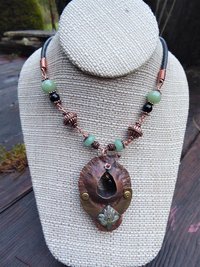Copper forged fold form mixed metal cocoon pendant with beads