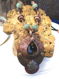 Copper forged fold form mixed metal cocoon pendant with beads