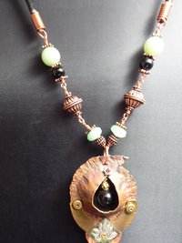 Copper forged fold form mixed metal cocoon pendant with beads
