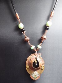 Copper forged fold form mixed metal cocoon pendant with beads