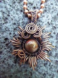 Copper corona pendant with multicolored stone center