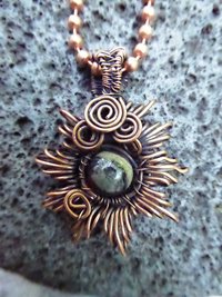 Copper corona pendant with multicolored stone center