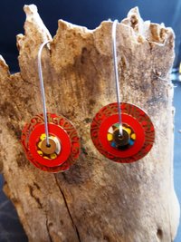 Festive red recycled tin large hoop dangles in a unique design
