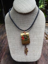Tibetan inspired prayer pendant in brass with recycled tin word - Trust