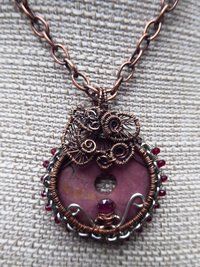 Bold and sassy rhodonite mixed metal donut pendant