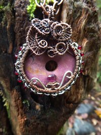 Bold and sassy rhodonite mixed metal donut pendant