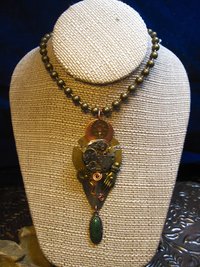 Steampunk mixed metal watchwork gear pendant called Full Steam Ahead
