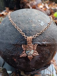 Copper corona pendant with brightly colored abalone shell center