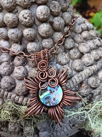 Copper corona pendant with brightly colored abalone shell center