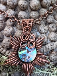 Copper corona pendant with brightly colored abalone shell center