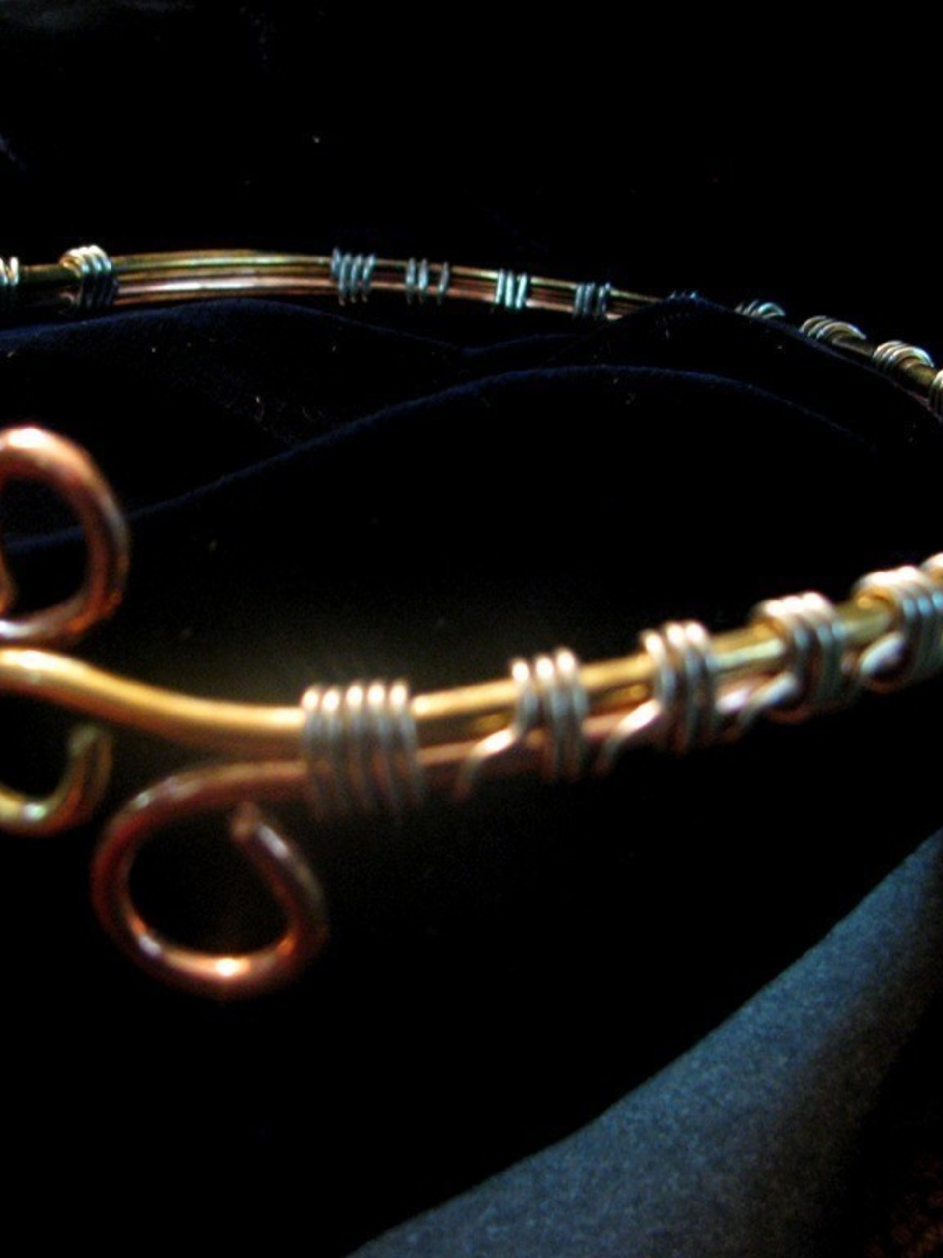 Upper Arm cuff  bracelet of copper, brass, and silver wire.