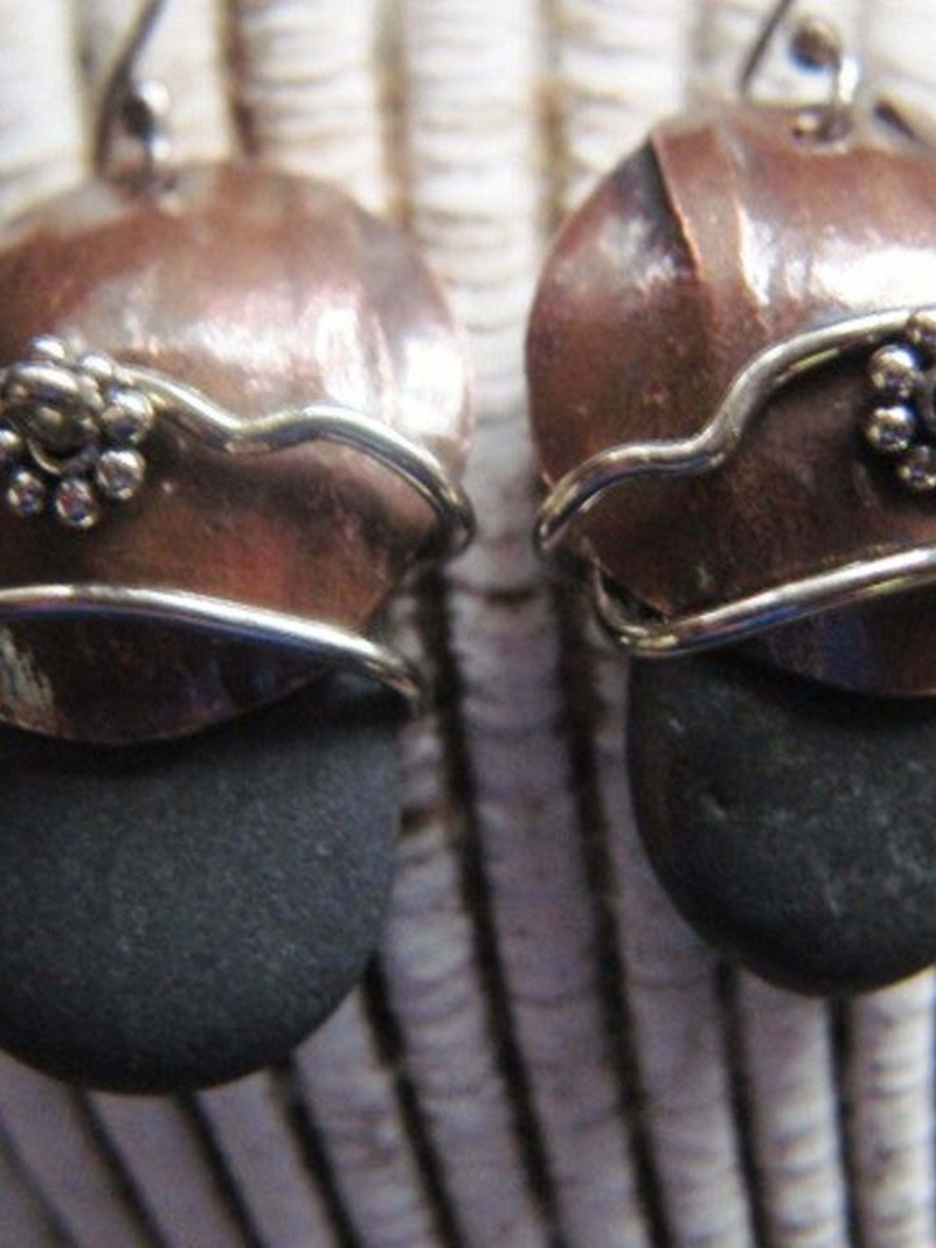 Natural beach stone and copper Om rock earrings