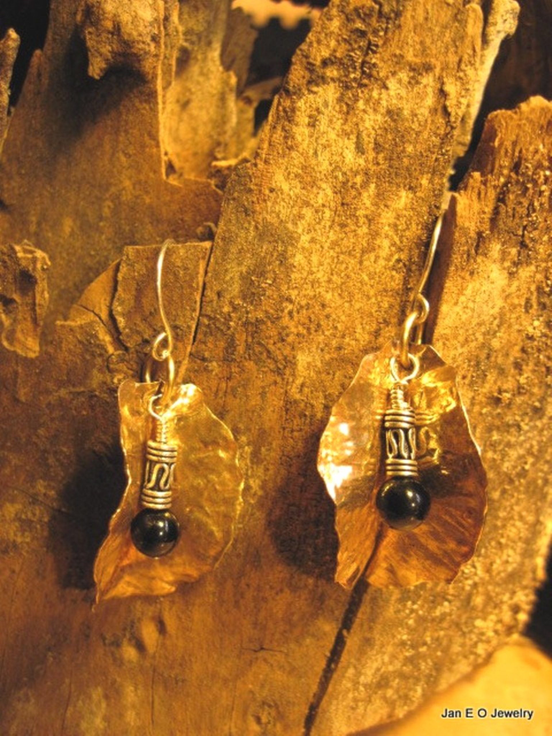 Tribal fold form bronze leaf earrings with sterling and black onyx