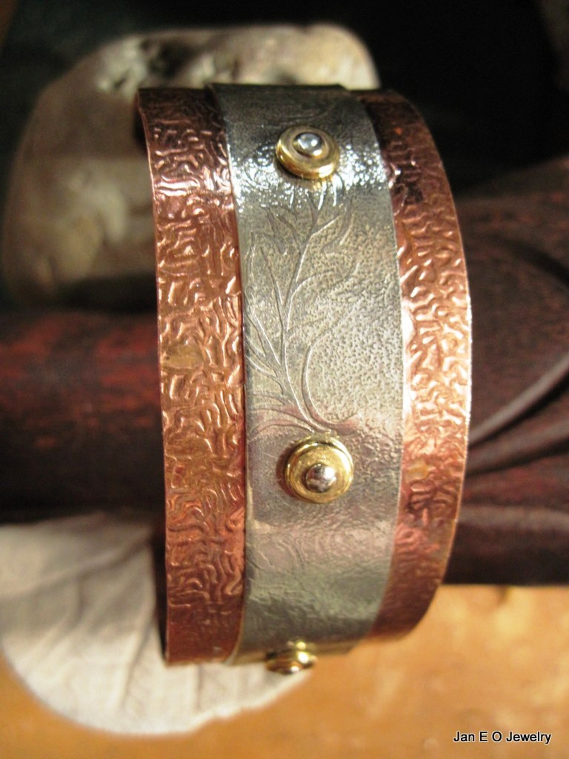 Mixed metal copper and German silver textured leaf design healing cuff