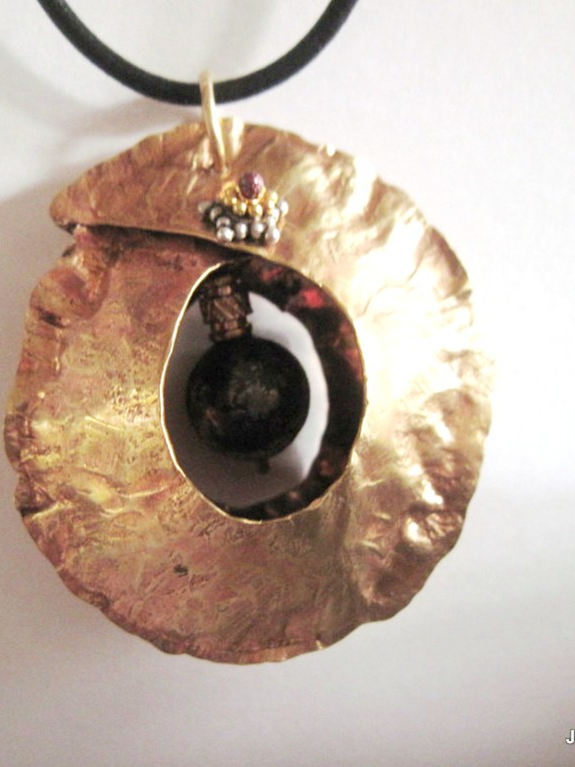 Tribal fold form bronze and iron pyrite healing cocoon pendant