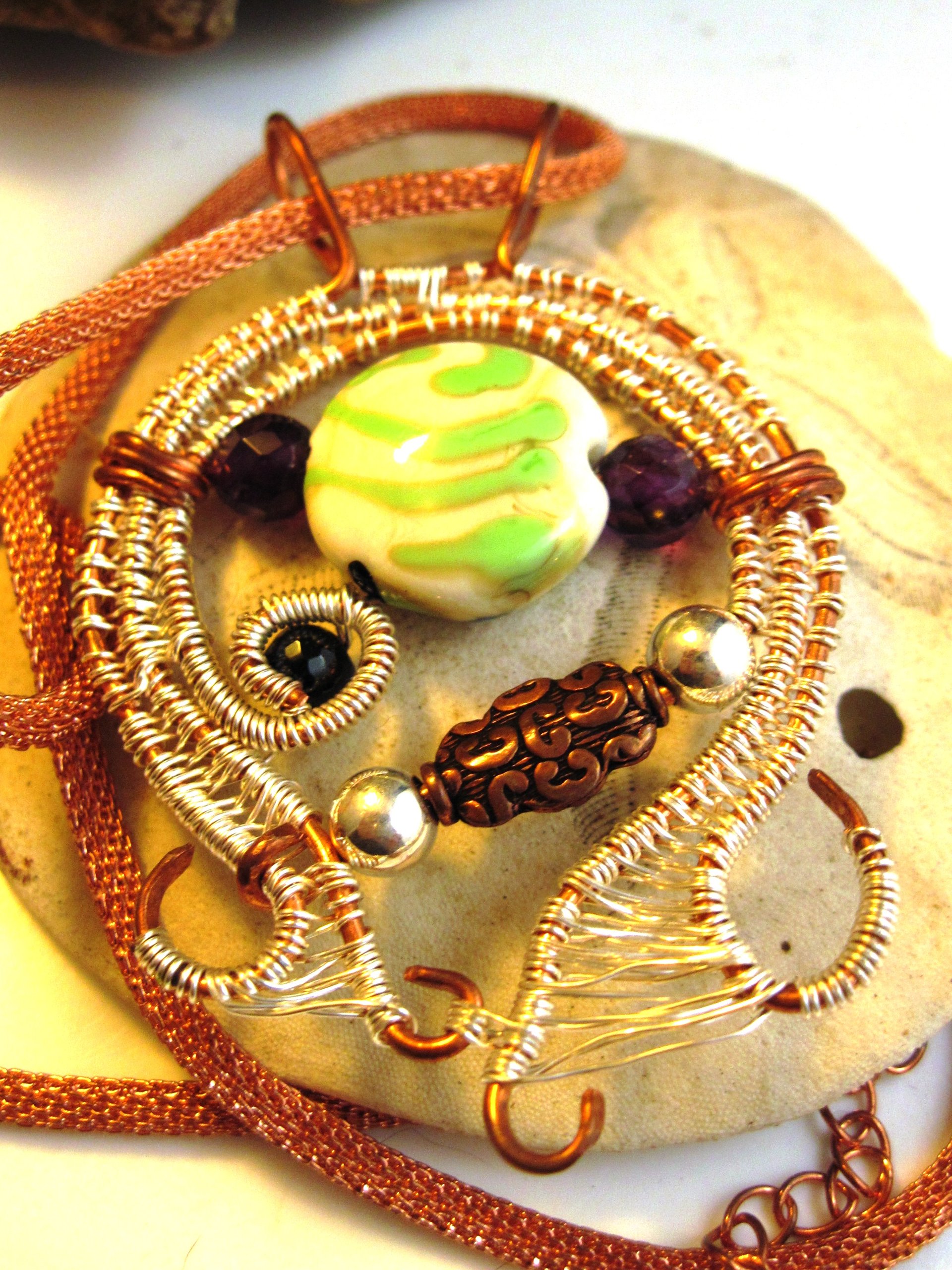 Mixed metal sterling and copper wire woven lampwork organic swirling pendant