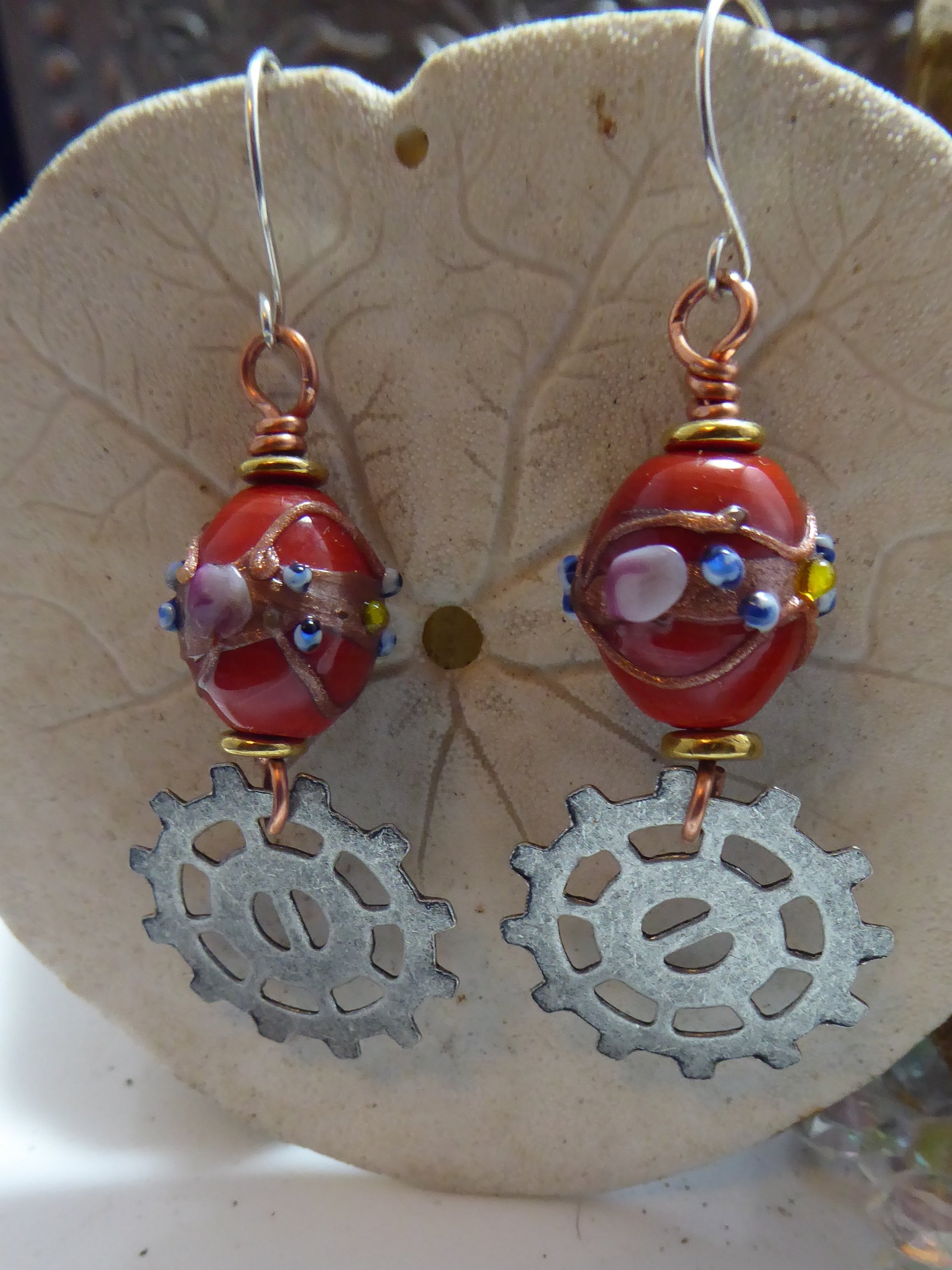 Geared up steampunk orange lampwork dangle earrings