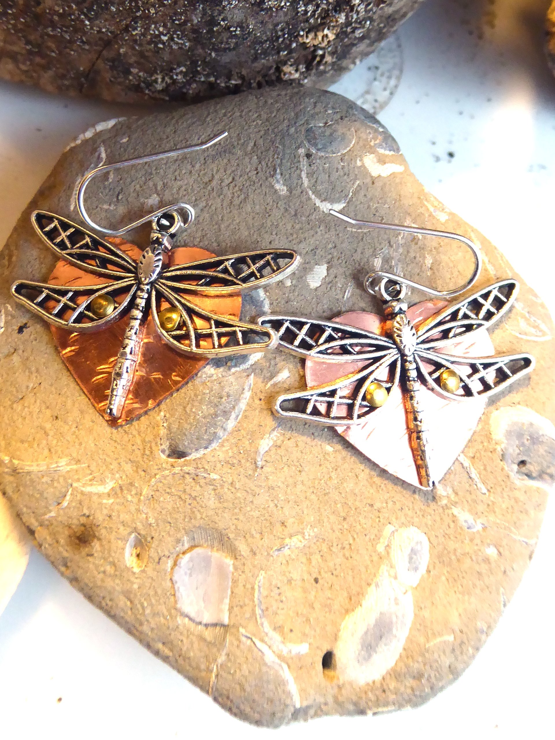 Mixed metal dangle dragonfly earrings with a copper heart