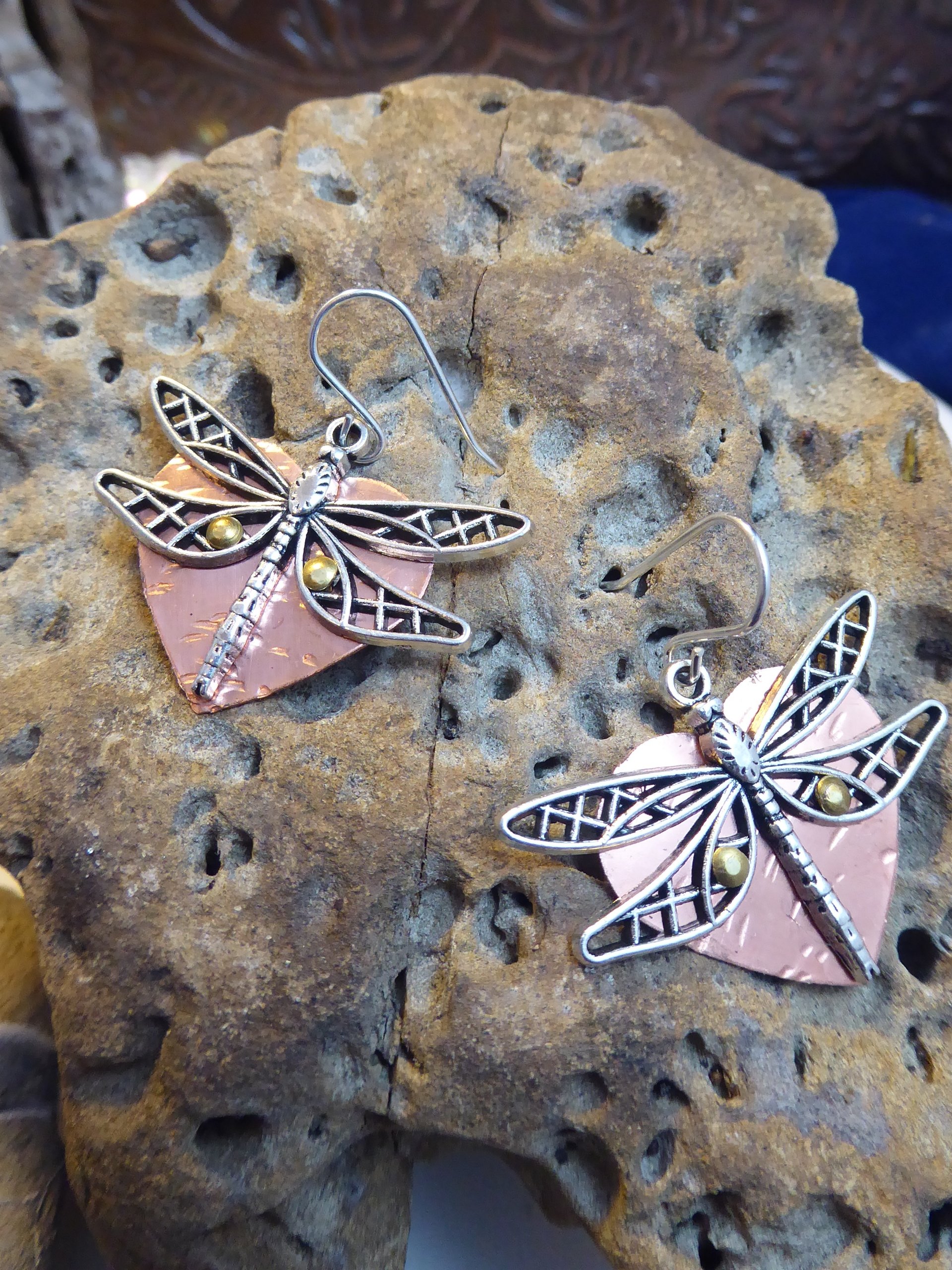 Mixed metal dangle dragonfly earrings with a copper heart