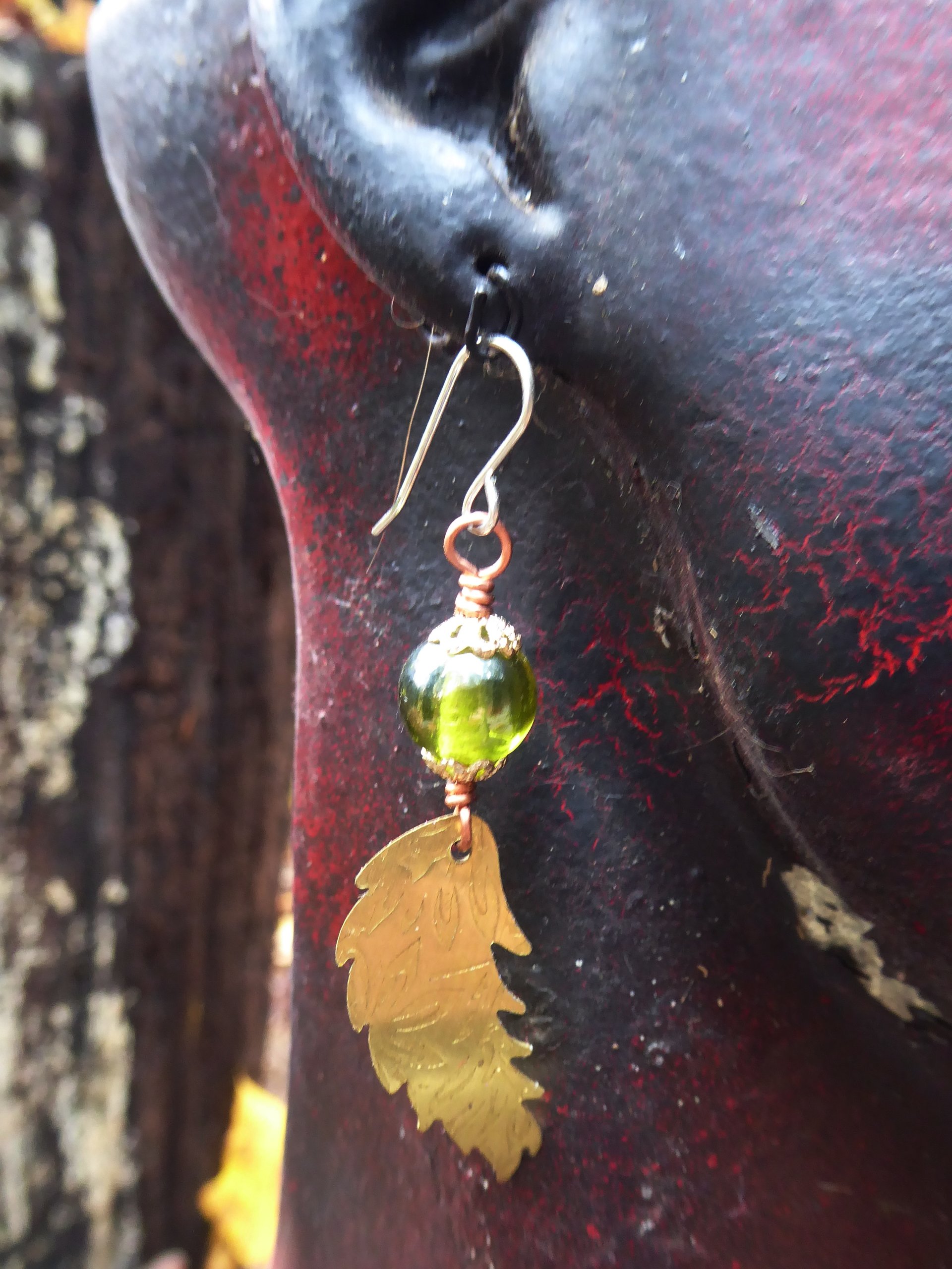 Bead and feather brass dangle earrings