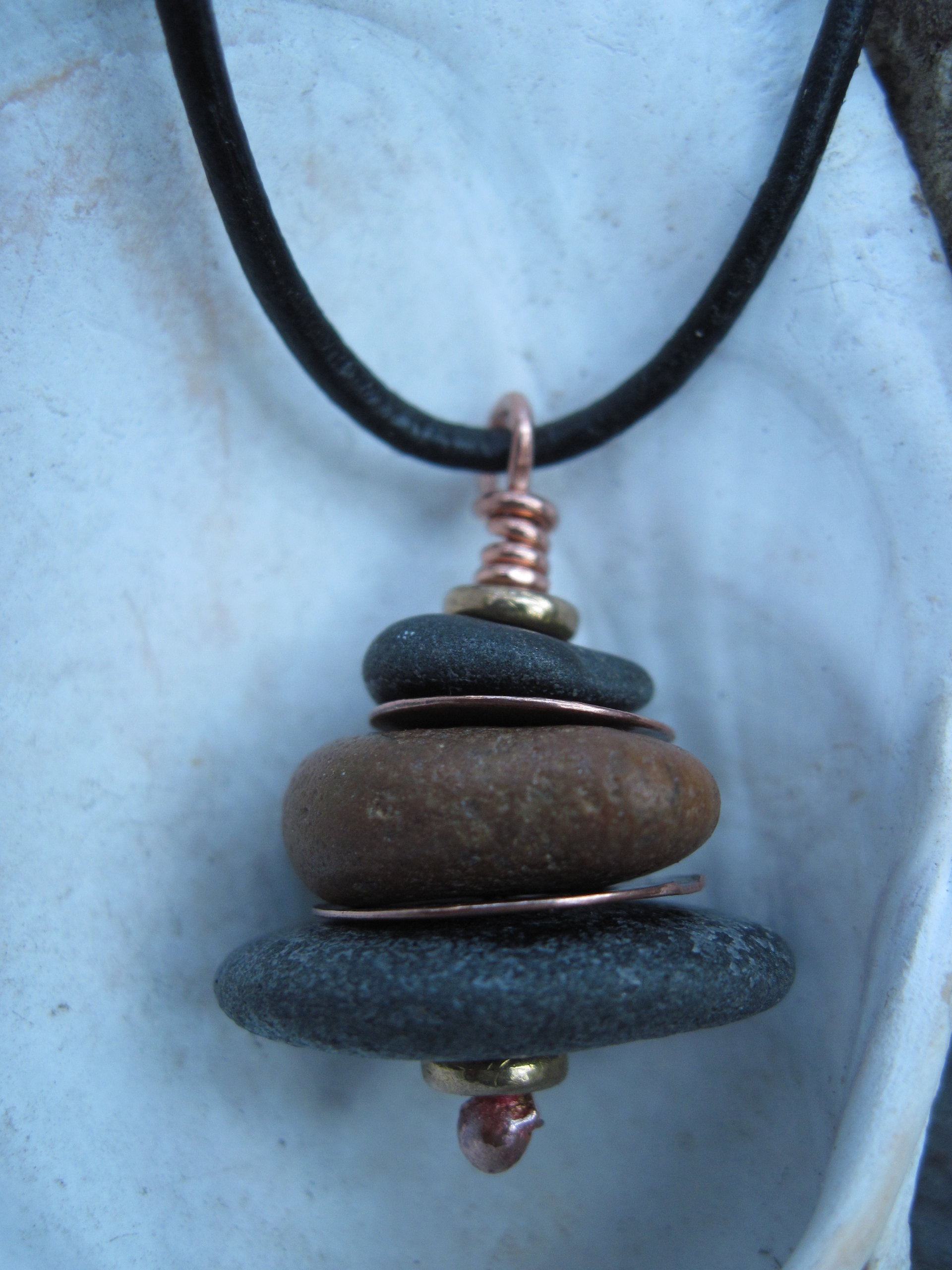 Beach stone stacked rock with copper Om rock cairn zen pendant