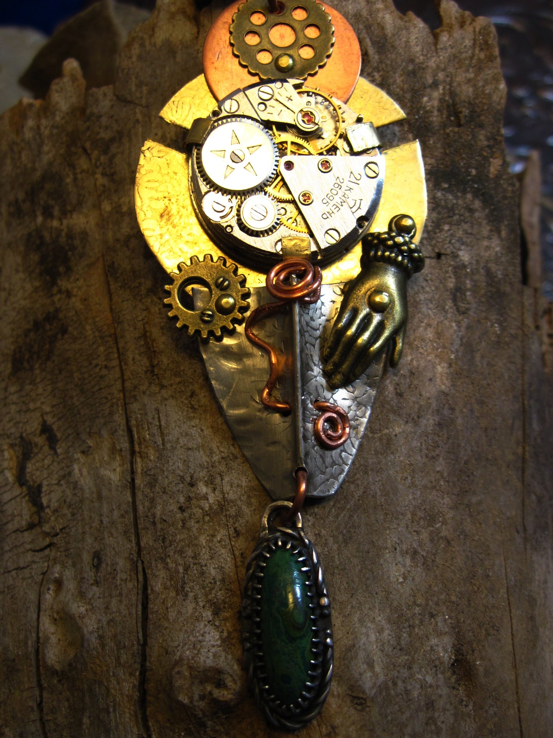 Steampunk mixed metal watchwork gear pendant called Full Steam Ahead