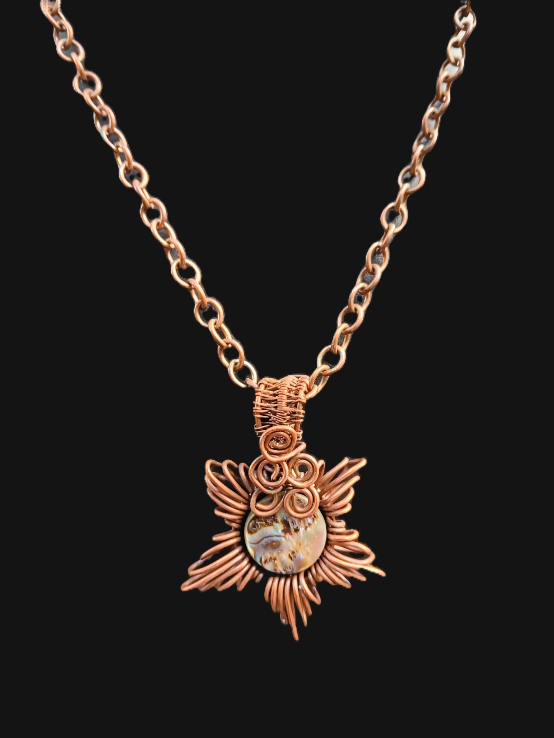 Copper corona pendant with brightly colored abalone shell center
