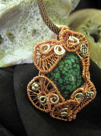 Copper and silver wire woven turquoise pendant