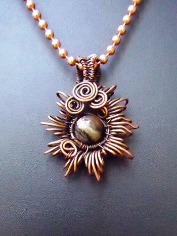 Copper corona pendant with multicolored stone center