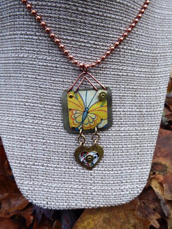 Trashy tin butterfly mixed metal love pendant