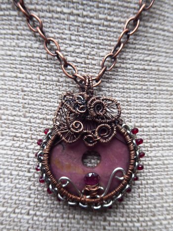 Bold and sassy rhodonite mixed metal donut pendant